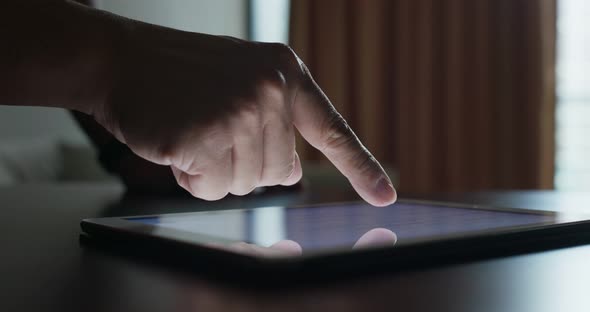 Woman use of tablet computer at home