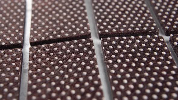 Non-slip pads. Chair leg floor protector with dotted texture. Macro