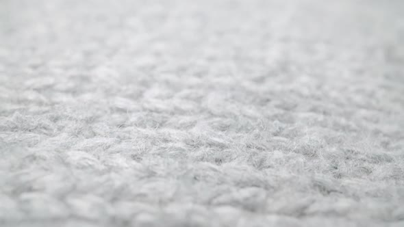 Extreme Detail View of Sheep Wool Cloth Texture Flowing in Macro Dolly Shot