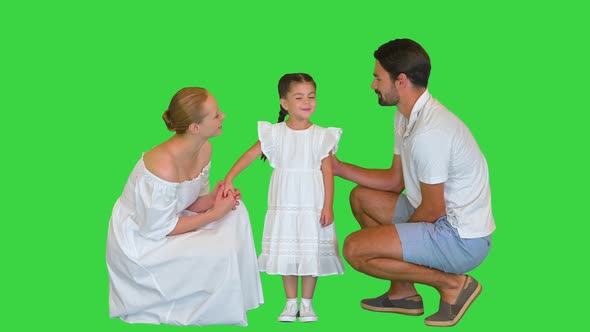 Happy Daughter Talking To Her Parents on a Green Screen Chroma Key