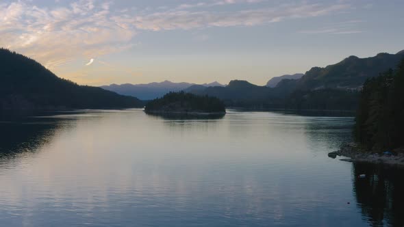 Speedboat Floating On The Calm Waters Of Sechelt Inlet On A Sunset - A Pacific Ocean Fjord Near The