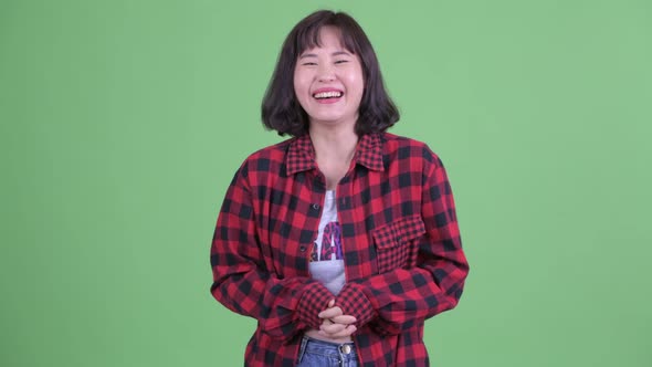 Happy Asian Hipster Woman Laughing and Pointing at Camera