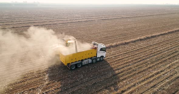 Aerial view of a tractor and a lorry working in a field, Kibbutz Saar, Israel.