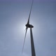 Wind turbine in operation against a background of blue sunny sky. the silhouette of the wind turbine - VideoHive Item for Sale