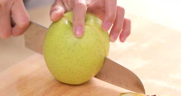 Cutting apple into small pieces