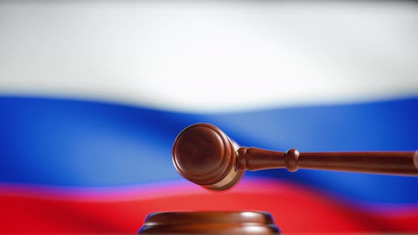 A Judge Gavel with a Flag of Russia on Background