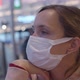 Woman in White Protective Mask Waits for Flight in Airport - VideoHive Item for Sale