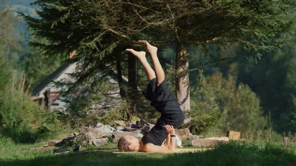 Sporty Woman Training in Mountain Forest