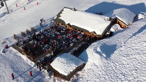 Majestic Winter Aerial Landscape and Ski Resort with Typical Alpine Wooden Houses in French Alps