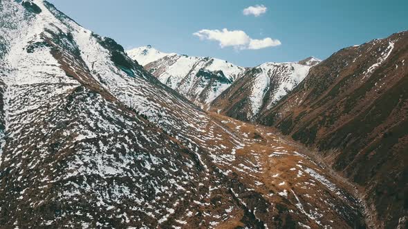 Autumn Mountains Covered with Snow in Places