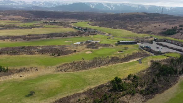 Panoramic View Of The Scenic Golf Course In Reykjavík, Iceland During Summertime. Forward Aerial