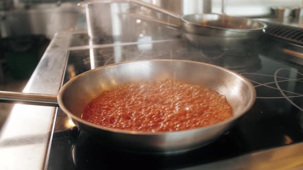 Chef Cooking Tasty Pasta Tomato Sause on Restaurant Kitchen Traditional Italian Food High Kitchen