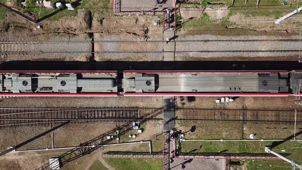 Top View of a Dangerous Railway Crossing in the City. People Walks on Rails