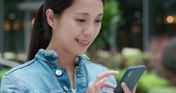 Woman use of mobile phone at outdoor