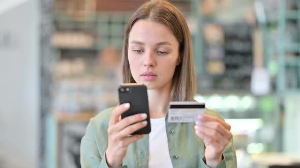 Portrait of Woman Making Online Payment on Smartphone