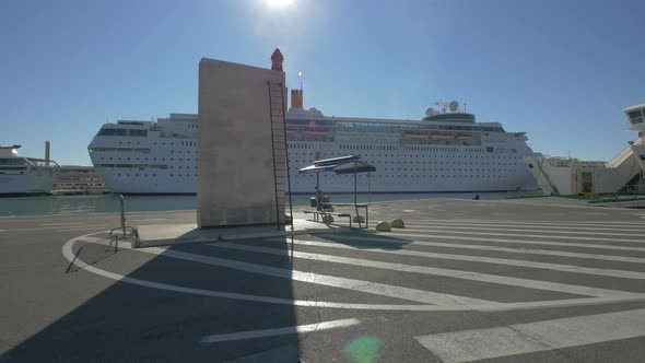 Cruise ship behind a massive granite block 