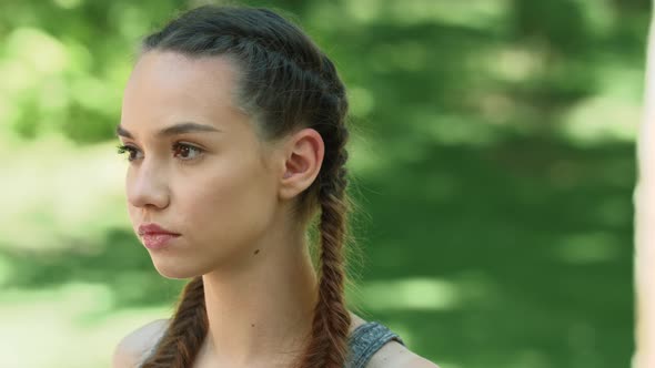 Sport Woman Listening Music in Earphones at Outdoor Workout