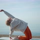 Young Woman Doing Morning Yoga Stretching on the Sea - VideoHive Item for Sale