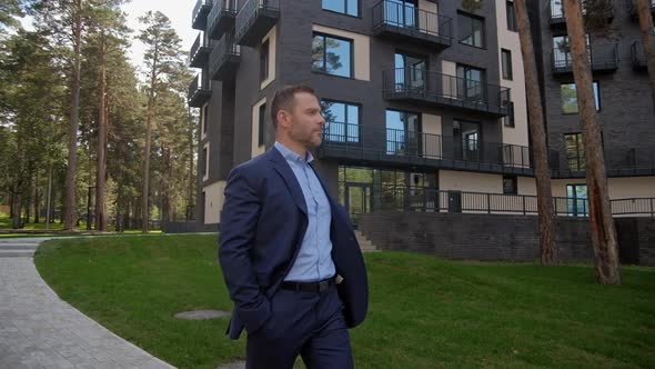 Man at Business Trip Walking To the Hotel Building