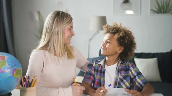 Woman Mama Making Homework with Her Little Kid