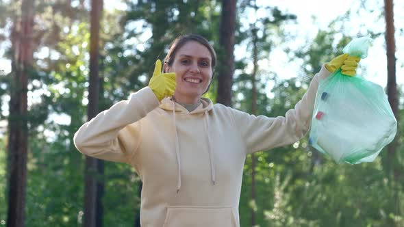 Positive Volunteer Female Raises Thumbs Up