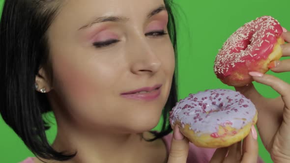 Happy Beautiful Young Girl Posing and Having Fun with Donuts. Chroma Key