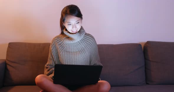 Woman use of laptop computer at home