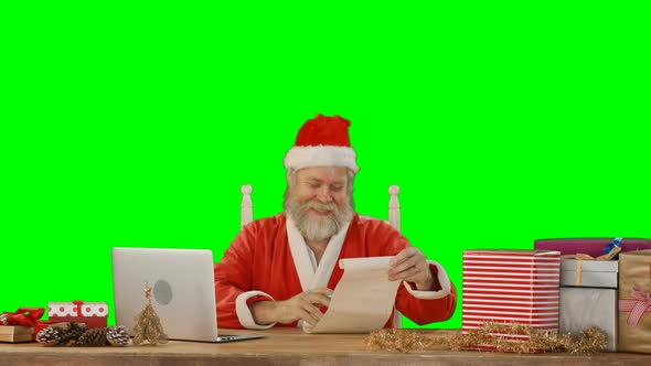 Santa claus using laptop