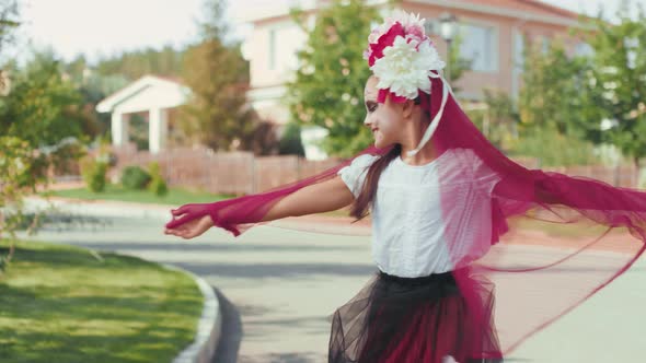 Happy Girl in Halloween Costume Twirling for Camera