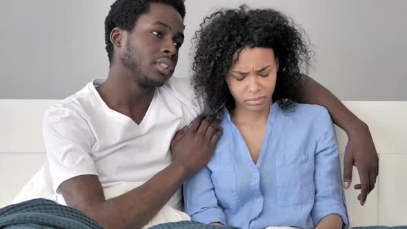 African Man Comforting Upset Girlfriend