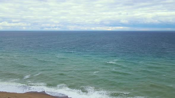 High and powerful waves coming fast to the beach, waves in winter day