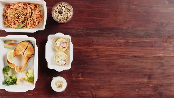 Food Delivery Top View Take Away Meals in Disposable Containers on Table