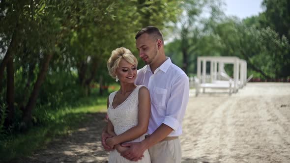 Elegant Bride and Groom Posing Together Outdoors on a Wedding Day