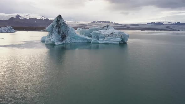 a drone footage of an iceberg in jokusarlon glacier lagoon