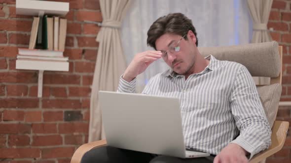 Middle Aged Man with Laptop Sleeping on Sofa