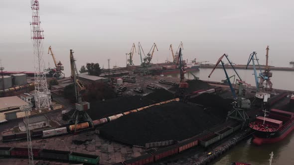 Aerial View of the Seaport with Cargo Ships and Tankers Carrying Coal and Oil to the Territory of