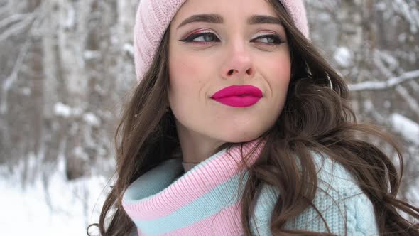 Beautiful Woman in Snowy Countryside