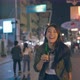 Asian young woman traveler drink bottle of beer while walk on street. - VideoHive Item for Sale