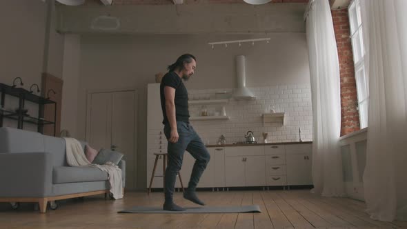 Man Practicing Yoga at home