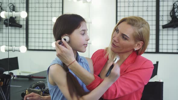 Happy Mom and Daughter Having Fun at the Beauty Salon