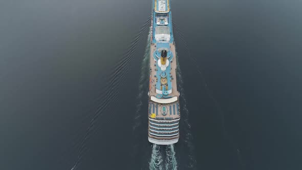 Large Luxury Cruise Ship Is Going in Fjord of Norway. Aerial Vertical View