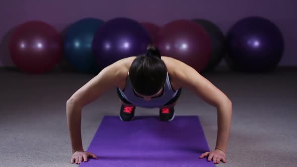 Strong Woman Doing Push-Ups, Training Hard in Gym to Have Healthy Fit Body