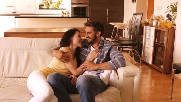 Couple relaxing on sofa in the living room