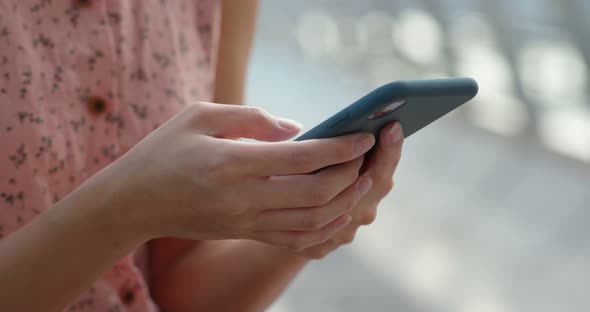 Woman use of mobile phone at outdoor