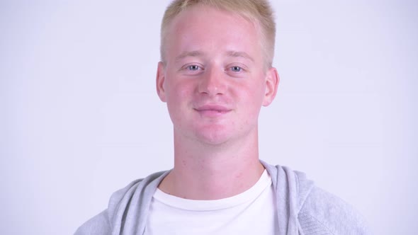 Face of Happy Blonde Young Man Smiling