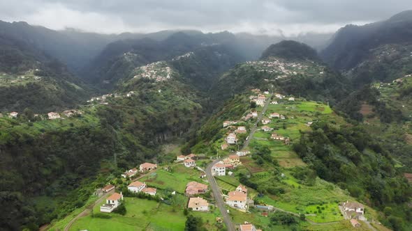 Dramatic Scenery of Isolated Village Within Volcanic Mountains