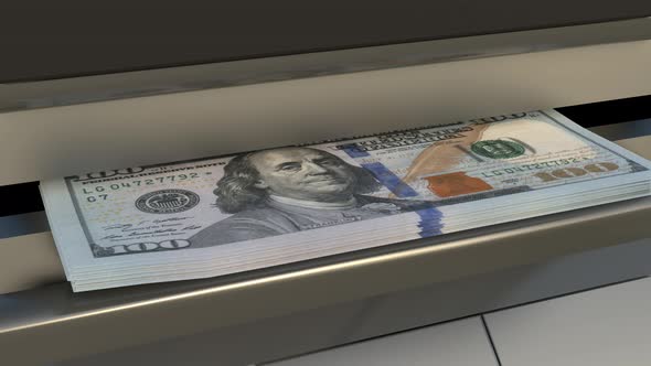 100 US dollar in cash dispenser. Withdrawal of cash from an ATM.