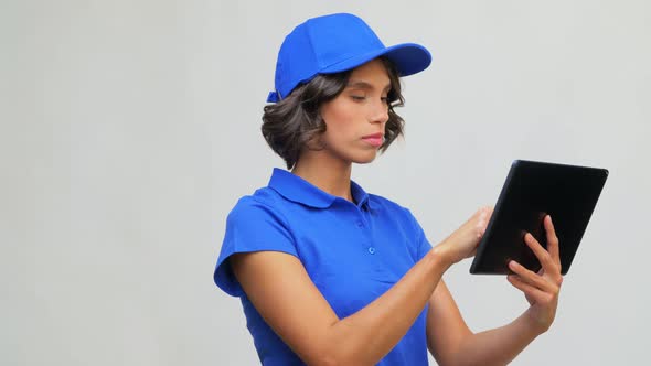 Delivery Girl in Blue Uniform with Tablet Computer