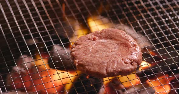 Beef Burger on Barbecue Metal Net