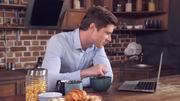 Student Talking with Friend and Relish Cereal